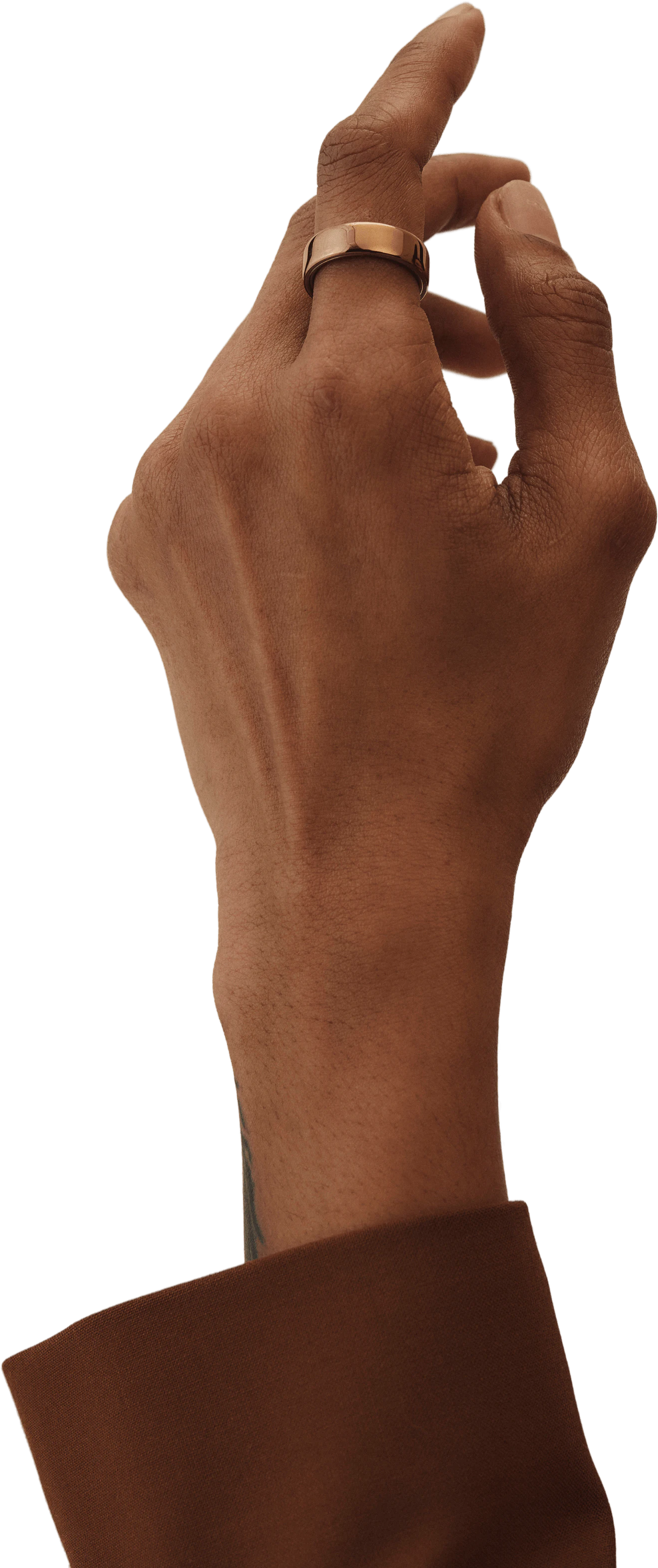 A left hand pointing upwards wearing an Oura Ring 5 in Deep Rose finish on its index finger