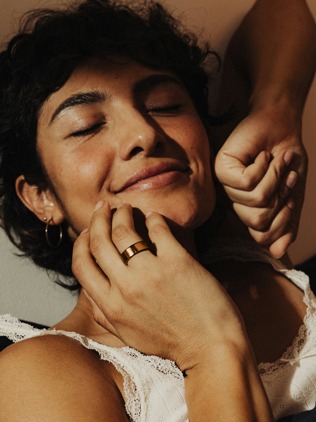Photo of a woman wearing an Oura Ring