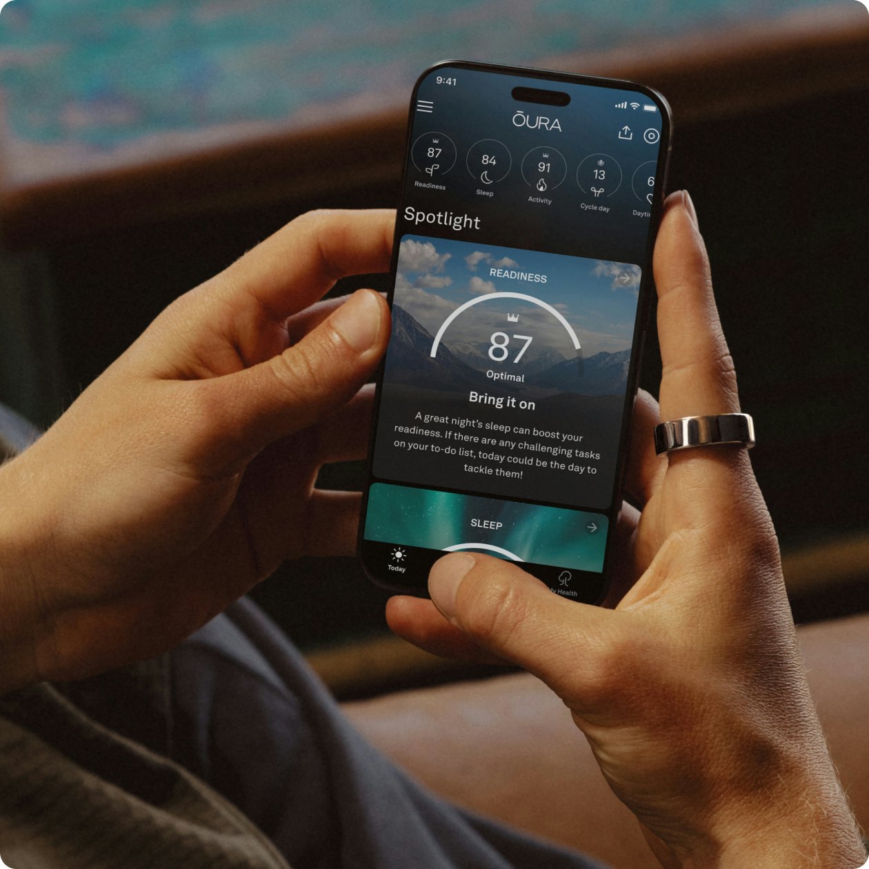 A phone screen representing Oura's daily engagement through dynamic scores and real-time feedback.